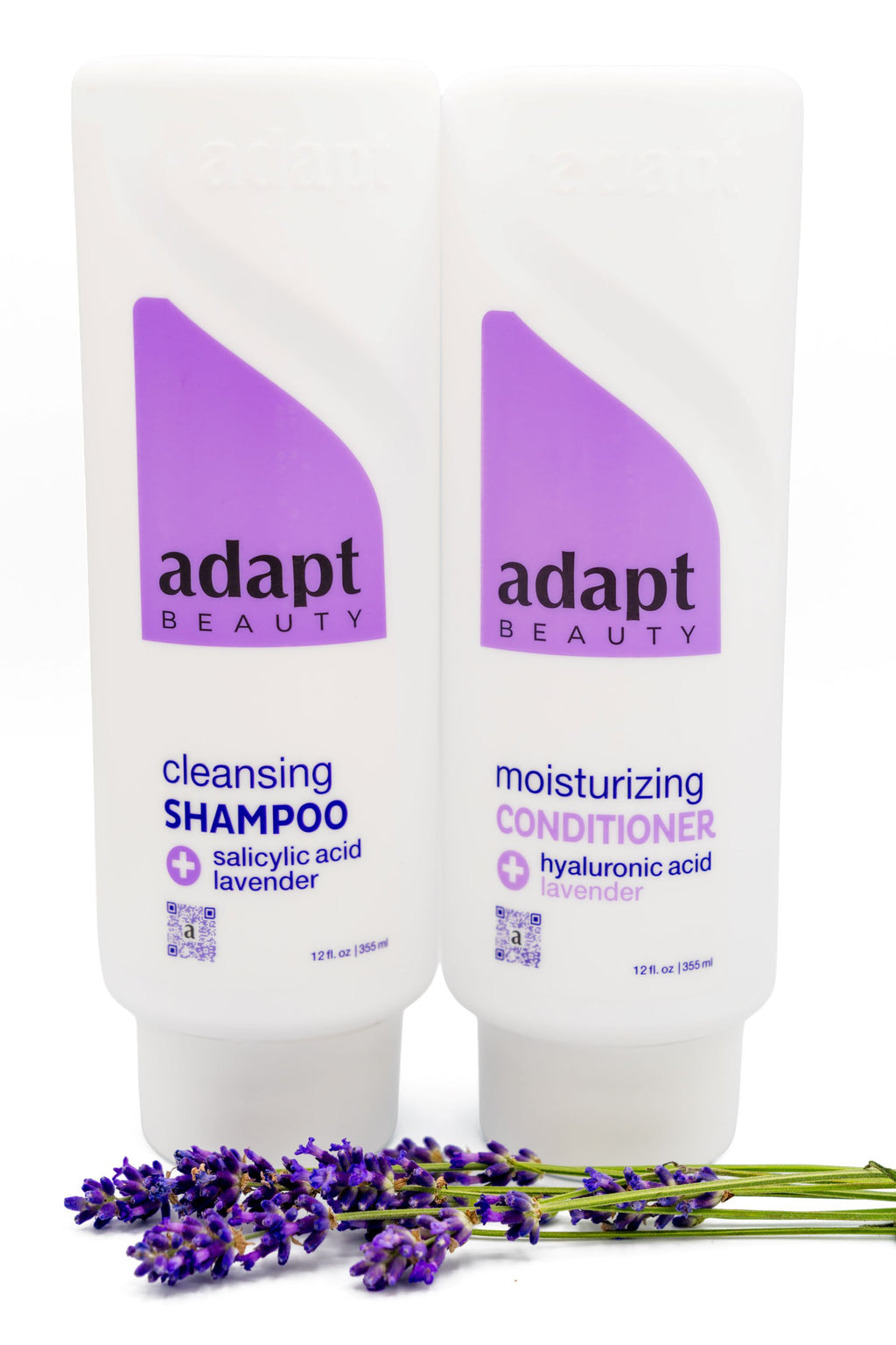 Adapt Beauty Shampoo and Conditioner bottles shown with lavender sprigs