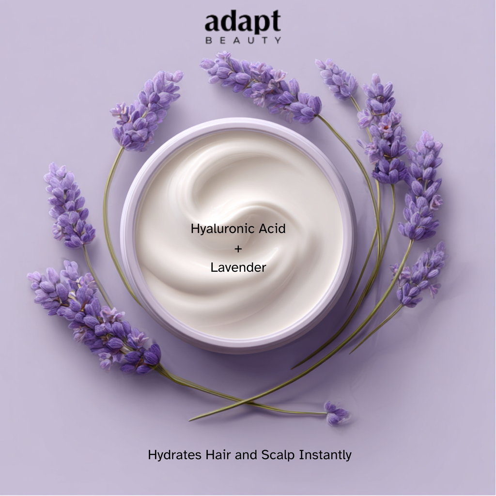 Adapt Beauty cream with hyaluronic acid and lavender surrounded by lavender flowers on a purple background.